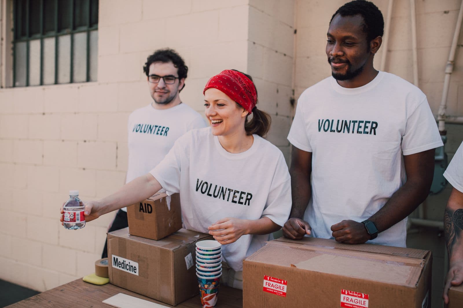Volunteers handing out aid